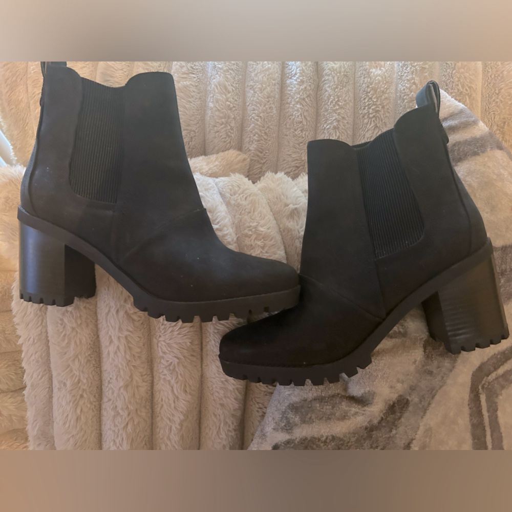 At least 2 year old Never Used UGG black leather ankle high heeled boots